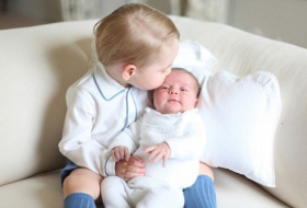 Prince George shows off his little princess, Charlotte - PHOTOS